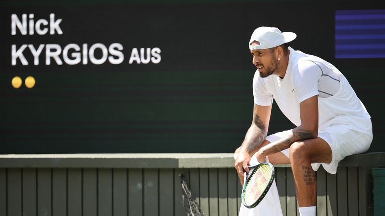 Nick Kyrgios of Australia takes a rest during the game of the gentlemen&#39;s singles fourth-round match in the Championships, Wimbledon at All England Lawn Tennis and Croquet Club in London, the United Kingdom on July 4, 2022.