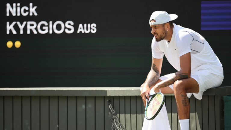 Nick Kyrgios of Australia takes a rest during the game of the gentlemen&#39;s singles fourth-round match in the Championships, Wimbledon at All England Lawn Tennis and Croquet Club in London, the United Kingdom on July 4, 2022.