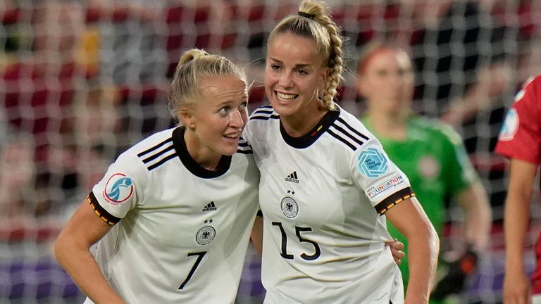 Lea Schueller, left, celebrates after scoring her Germany&#39;s second goal, scores her side&#39;s second goal during the Women Euro 2022 group B soccer match between Germany and Denmark at Brentford Community Stadium in London, Friday, July 8, 2022. (AP Photo/Alessandra Tarantino)