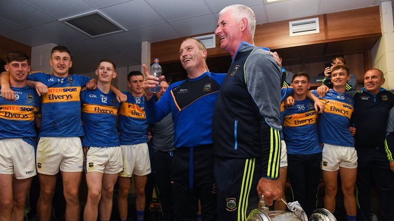 26 August 2018; Tipperary manager Liam Cahill, left, and selector John Sheedy celebrate with the the James Nowlan Cup with their players in the dressing room after the Bord Gais Energy GAA Hurling All-Ireland U21 Championship Final match between Cork and Tipperary at the Gaelic Grounds in Limerick. Photo by Piaras .. M..dheach/Sportsfile