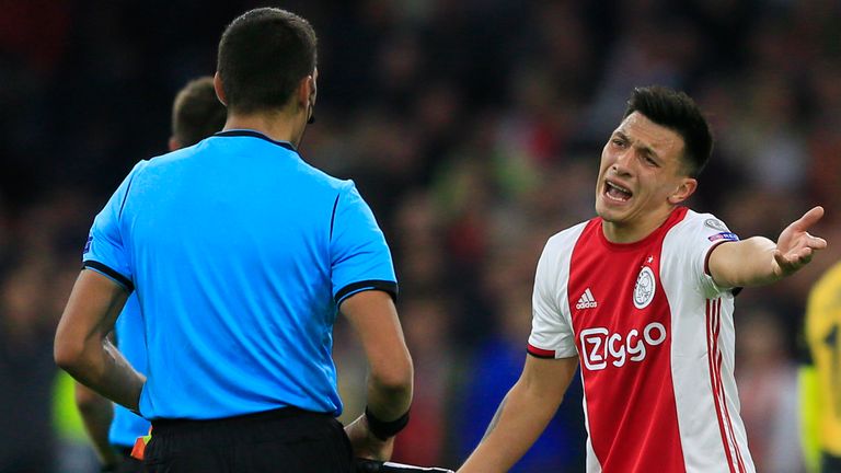 Ajax's Lisandro Martinez complains to the referees for stopping the match half time during an Ajax attack in the group H Champions League soccer match between Ajax and LOSC Lille at Johan Cruyff ArenA in Amsterdam, Netherlands, Tuesday, Sept. 17, 2019.
