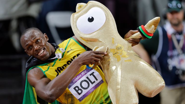 Usain Bolt celebrates winning gold in the men's 100-meter final during the athletics in the Olympic Stadium