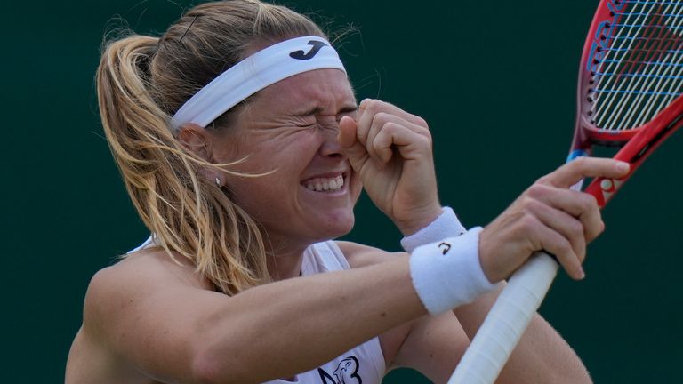Marie Bouzkova of the Czech Republic celebrates defeating France's Caroline Garcia in a fourth round women's singles match on day seven of the Wimbledon tennis championships in London, Sunday July 3, 2022. (AP Photo/Alastair Grant)