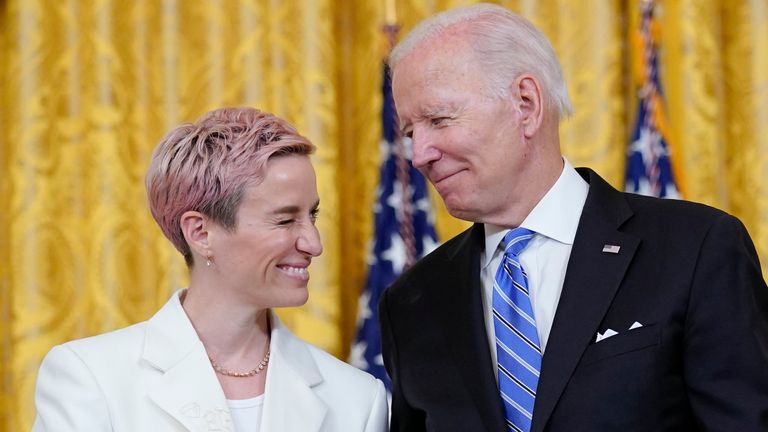 President Joe Biden shakes hands with Megan Rapinoe before presenting her with the Medal of Freedom (Photo: Susan Walsh/AP)
