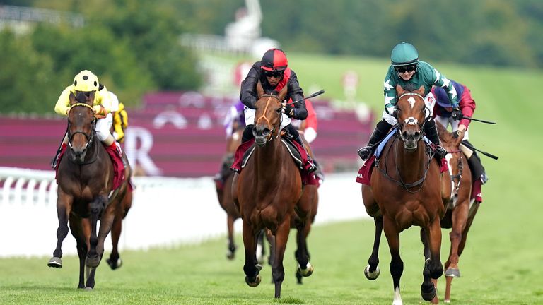 Nashwa (right) stretches away from Aristia to win the Nassau Stakes at Goodwood