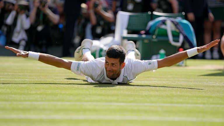 Serbia&#39;s Novak Djokovic celebrates after beating Australia&#39;s Nick Kyrgios to win the final of the men&#39;s singles on day fourteen of the Wimbledon tennis championships in London, Sunday, July 10, 2022. (AP Photo/Alastair Grant)