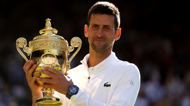 Novak Djokovic celebrates with the Trophy following his victory over Nick Kyrgios in The Final of the Gentlemen&#39;s Singles on day fourteen of the 2022 Wimbledon Championships at the All England Lawn Tennis and Croquet Club, Wimbledon. Picture date: Sunday July 10, 2022.