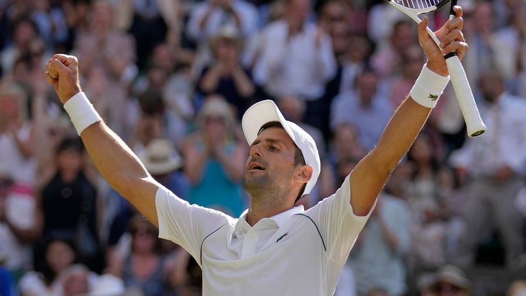 Novak Djokovic celebrates after beating Australia's Nick Kyrgios to win the Wimbledon men's final