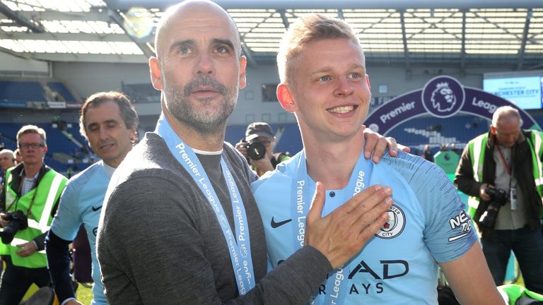 Manchester City coach Pep Guardiola (left) and Oleksandr Zinchenko celebrate their victory