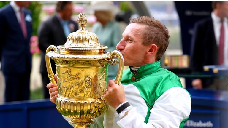 PJ McDonald kisses the King George trophy at Ascot after steering Pyledriver to success