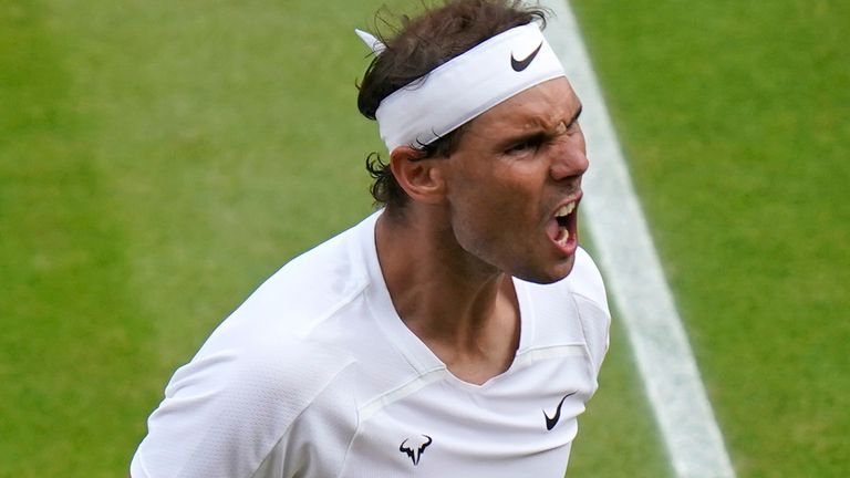 Spain's Rafael Nadal reacts after winning a point as he plays Taylor Fritz of the US in a men's singles quarterfinal match on day ten of the Wimbledon tennis championships in London, Wednesday, July 6, 2022. (AP Photo/Gerald Herbert)