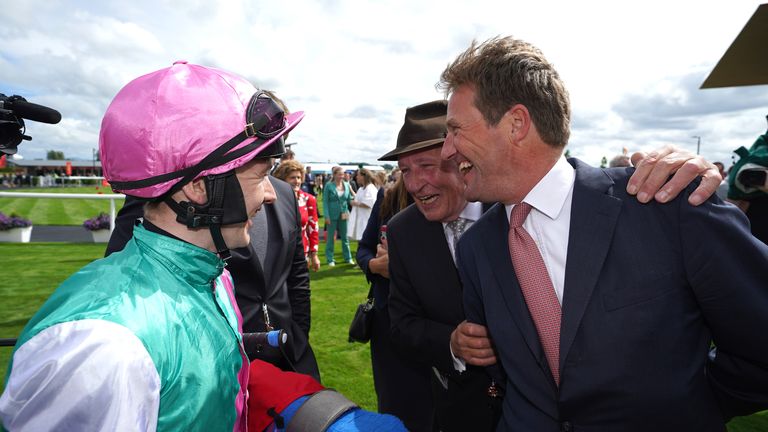 Beckett laughs with connections of Westover after taking the Irish Derby