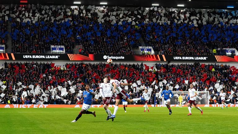General view of the action as Rangers fans hold flags up during the UEFA Europa League, Group A match at the Ibrox Stadium, Glasgow. Picture date: Thursday November 25, 2021.