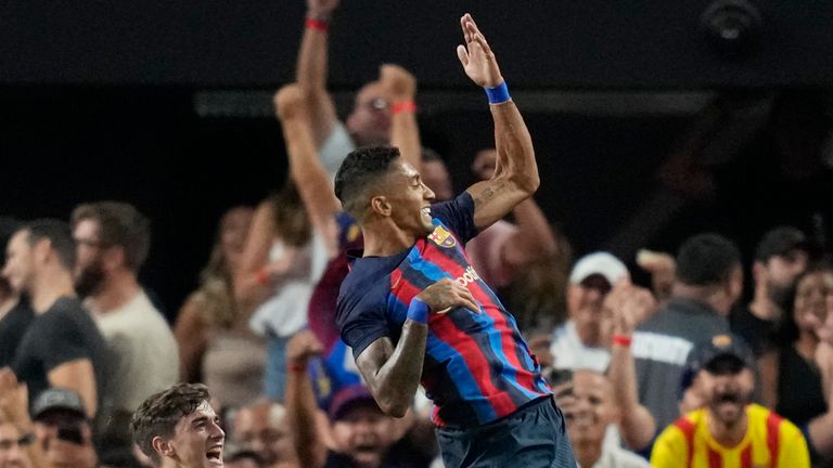Barcelona's Raphael Dias, right, celebrates after scoring against Real Madrid during the first half of a friendly soccer match Saturday, July 23, 2022, in Las Vegas. (AP Photo/John Locher)