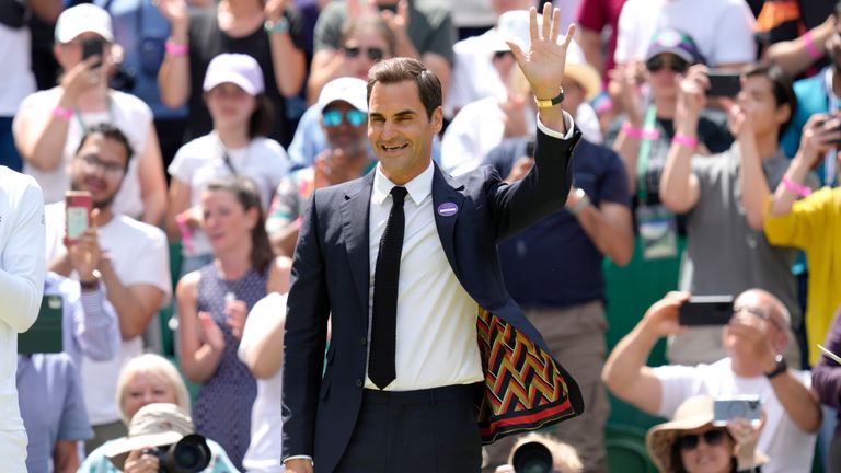 Switzerland's Roger Federer waves during the 100th anniversary celebration at Center Court on Saturday of the Wimbledon tennis championships in London, Sunday, July 3, 2022. (AP Photo/Kirsty Wigglesworth)