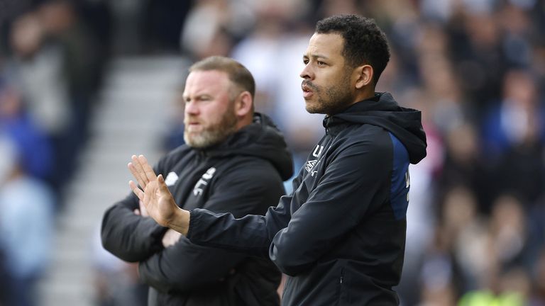 Derby County assistant manager Liam Rosenior (right) and manager Wayne Rooney on the touchline