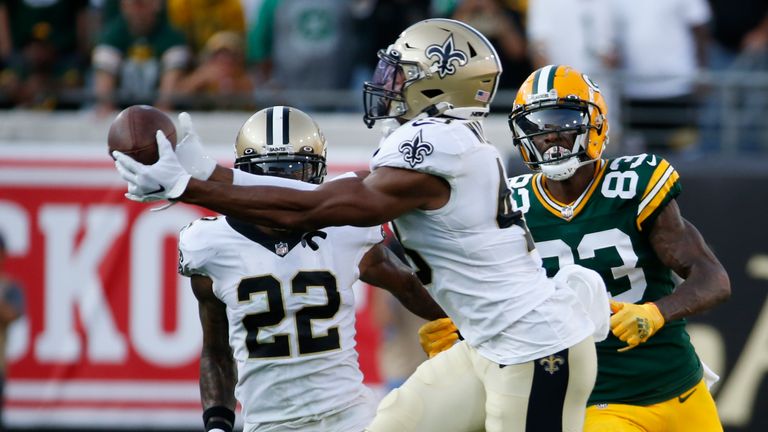 New Orleans Saints free safety Marcus Williams intercepts an Aaron Rodgers pass in front of Green Bay Packers wide receiver Marquez Valdes-Scantling