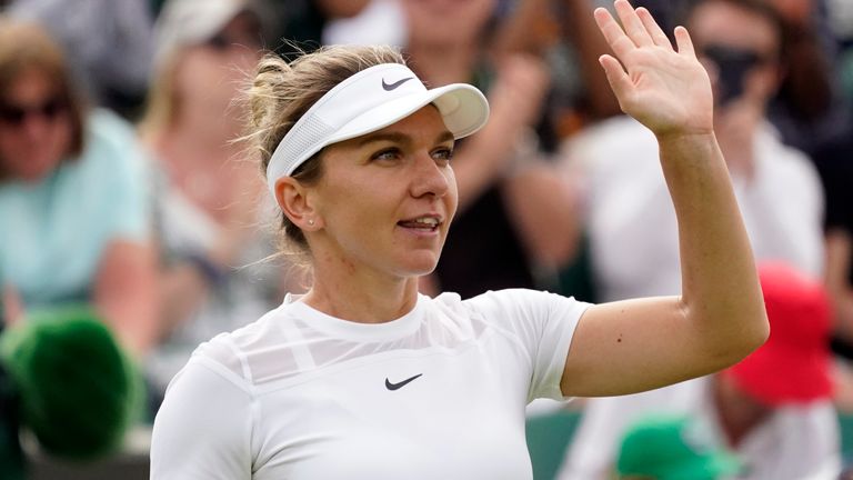 Romania&#39;s Simona Halep celebrates after beating Poland&#39;s Magdalena Frech in their women&#39;s third round singles match on day six of the Wimbledon tennis championships in London, Saturday, July 2, 2022. (AP Photo/Alberto Pezzali)