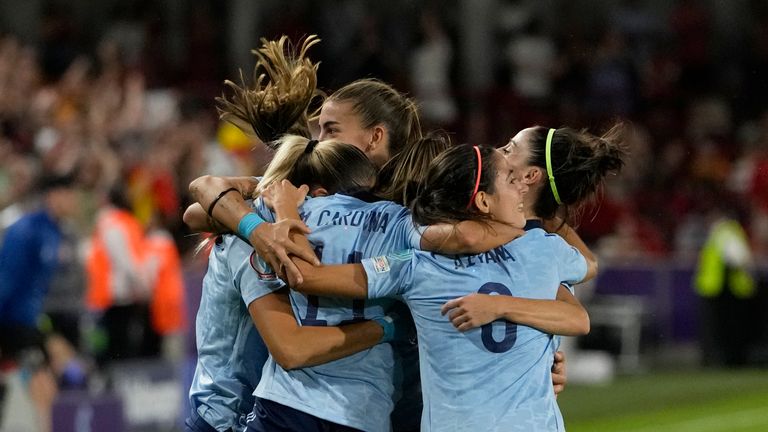 Spain players celebrate after Marta Cardona scored the opening goal during the Women Euro 2022 group B soccer match between Denmark and Spain
