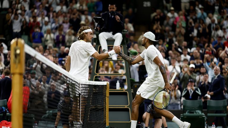 Stefanos Tsitsipas (left) and Nick Kyrgios shake hands after their Men's Singles third round match during day six of the 2022 Wimbledon Championships at the All England Lawn Tennis and Croquet Club, Wimbledon. Picture date: Saturday July 2, 2022.