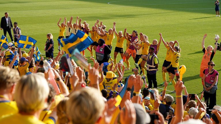 Sweden players celebrate with their fans after winning Group C and keeping up their perfect record of reaching the European Championships knock-out stages
