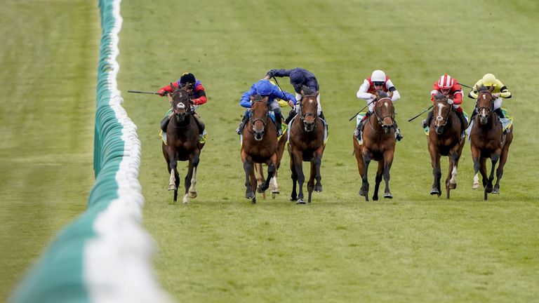 Tactical, left, wins at Newmarket in the colours of Her Majesty The Queen
