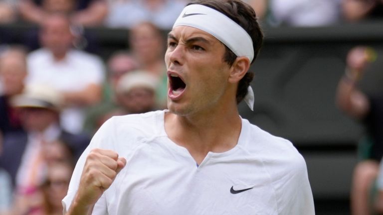 Taylor Fritz of the US reacts as he wins a point against Spain&#39;s Rafael Nadal in a men&#39;s singles quarterfinal match on day ten of the Wimbledon tennis championships in London, Wednesday, July 6, 2022. (AP Photo/Kirsty Wigglesworth)