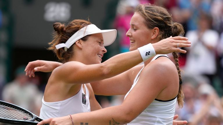 The two German players embraced at the net following their contest