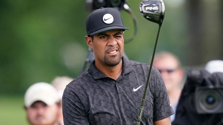 Tony Finau prepares to drive off the 14th tee during the third round of the Rocket Mortgage Classic golf tournament, Saturday, July 30, 2022, in Detroit. (AP Photo/Carlos Osorio)