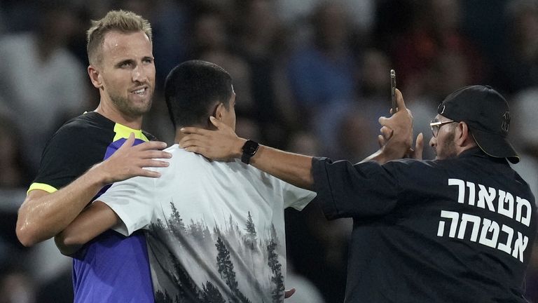 A fan takes a selfie with Tottenham's Harry Kane