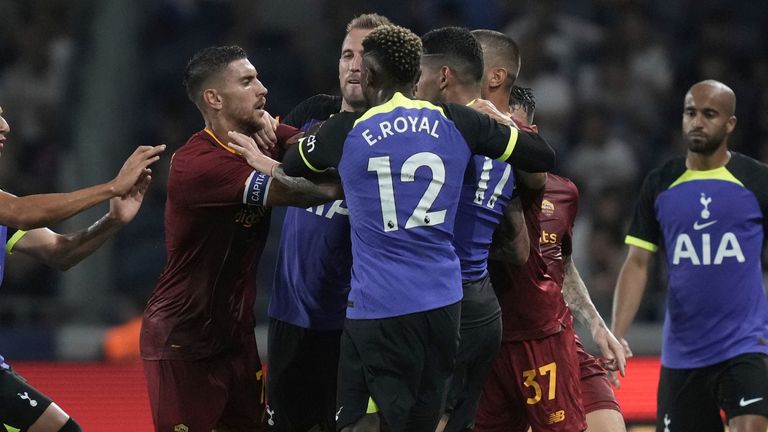 Tottenham and AS Roma players clash