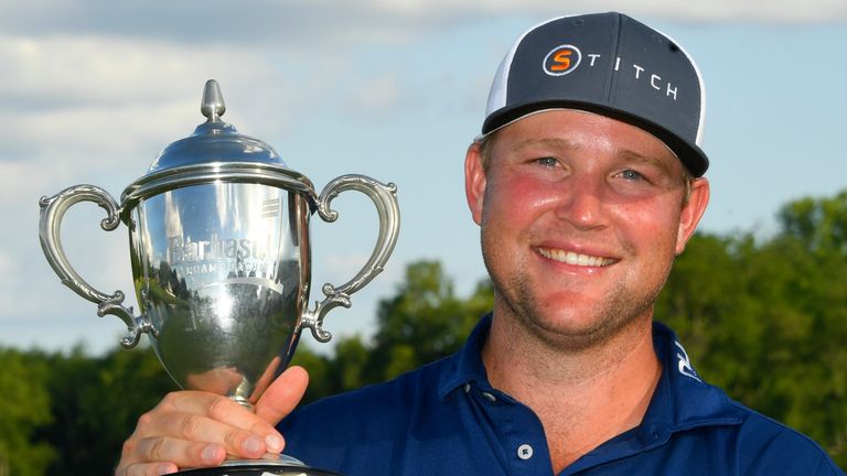 Trey Mullinax holds the trophy after winning the Barbasol Championship golf tournament, Sunday, July 10, 2022, in Nicholasville, Ky. (AP Photo/John Amis)