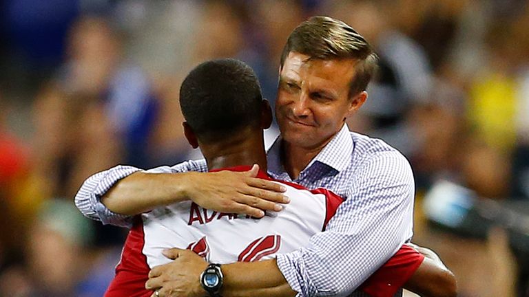 New York Red Bulls defender Tyler Adams (66) is hugged by manager Jesse Marsch after scoring a goal against Chelsea FC in the second half during a soccer match in the International Champions Cup in Harrison N.J., Wednesday, July 22, 2015. The Red Bulls defeated Chelsea 4-2. (AP Photo/Rich Schultz)