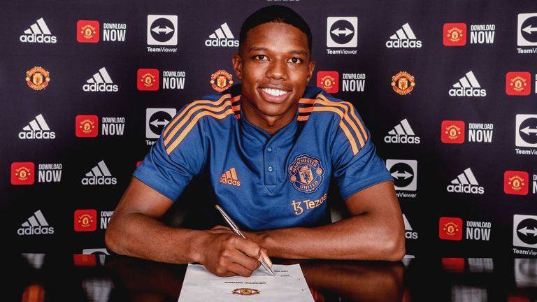 MANCHESTER, ENGLAND - JULY 05: (EXCLUSIVE COVERAGE) Tyrell Malacia of Manchester United poses after signing his contract with the club at Carrington Training Ground on July 05, 2022 in Manchester, England. (Photo by Ash Donelon/Manchester United via Getty Images)