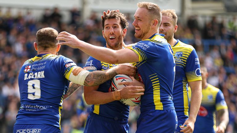 Stefan Ratchford is congratulated after scoring his try for Warrington