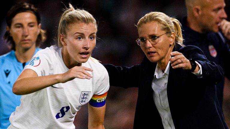 Sarina Wiegman talks to Leah Williamson during the game