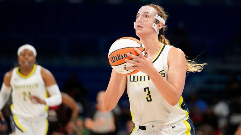 Dallas Wings guard Marina Mabrey (3) shoots and sinks a three-point basket in the first half of a WNBA basketball game against the Indiana Fever, Thursday, June 23, 2022, in Arlington, Texas. 