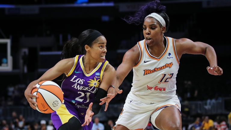  Jordin Canada #21 of the Los Angeles Sparks drives against Reshanda Gray #12 of the Phoenix Mercury in the first half at Crypto.com Arena on July 04, 2022 in Los Angeles, California. 