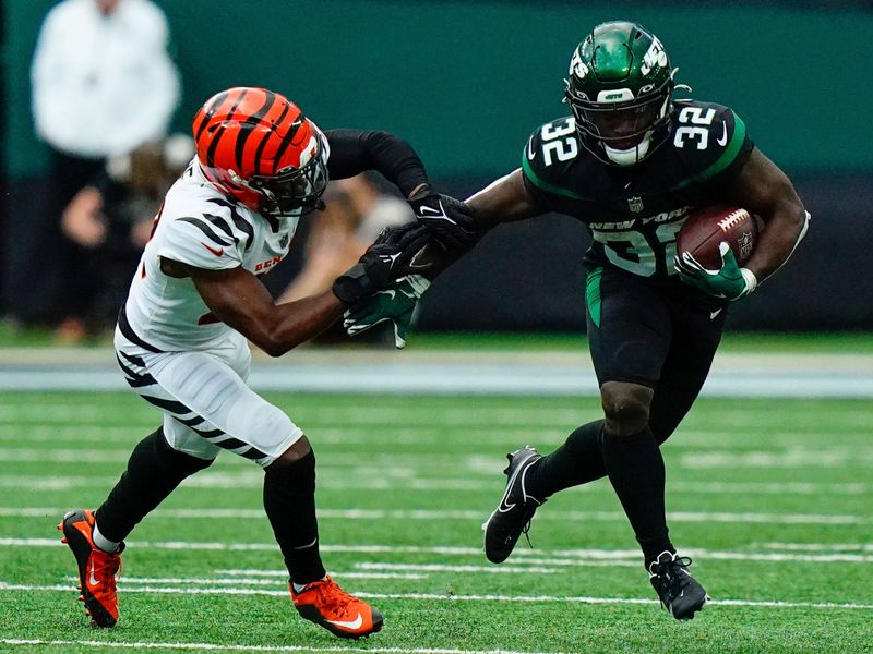 New York Jets running back Michael Carter (32) is tackled during