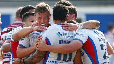 Wakefield's players celebrate at full-time after defeating Wigan
