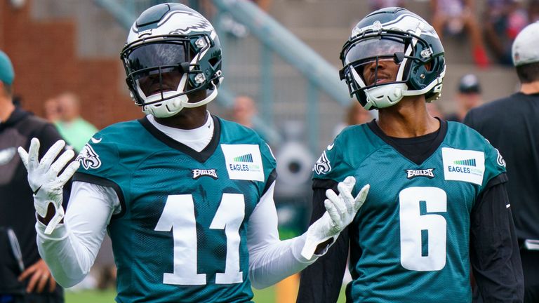 Philadelphia Eagles&#39; A.J. Brown, left, reacts with DeVonta Smith, right, during practice at NFL football team&#39;s training camp, Wednesday, July 27, 2022, in Philadelphia. (AP Photo/Chris Szagola)