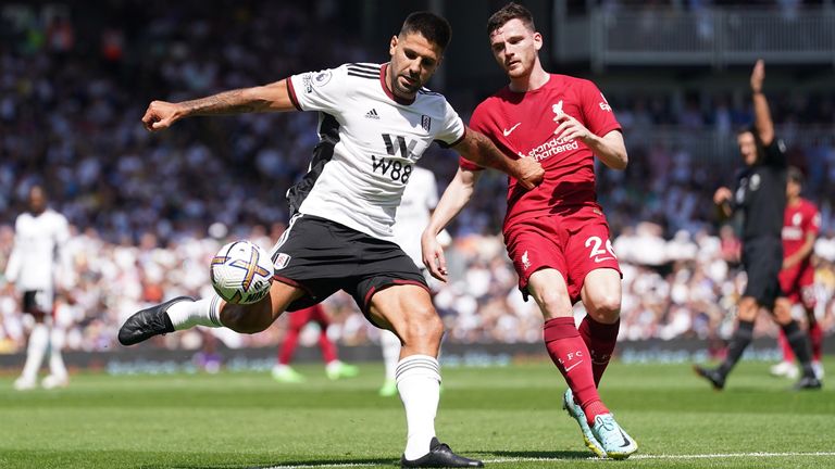 Fulham&#39;s Aleksandar Mitrovic (left) and Liverpool&#39;s Andrew Robertson battle for the ball