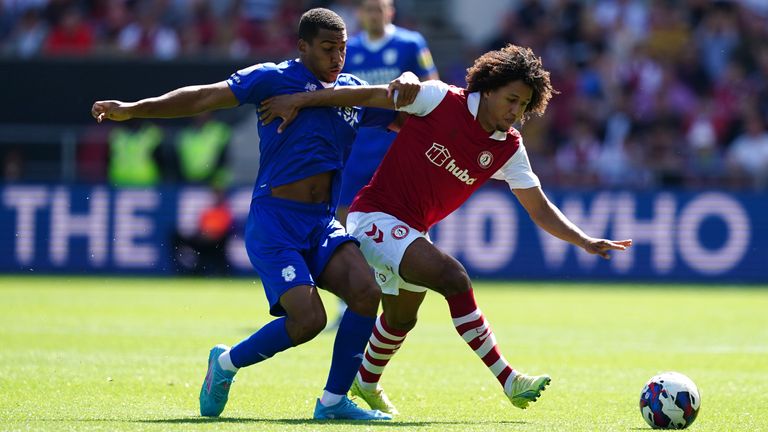 Cardiff City's Andy Rinomhota and Bristol City's Han-Noah Massengo compete for the ball