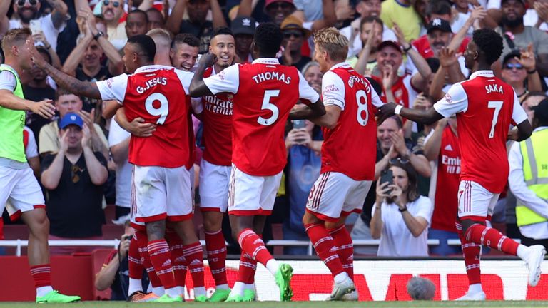 Granit Xhaka is mobbed by his team-mates after scoring Arsenal&#39;s third goal