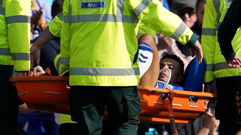 Everton&#39;s Ben Godfrey is carried off the pitch on a stretcher after picking up an injury (AP)