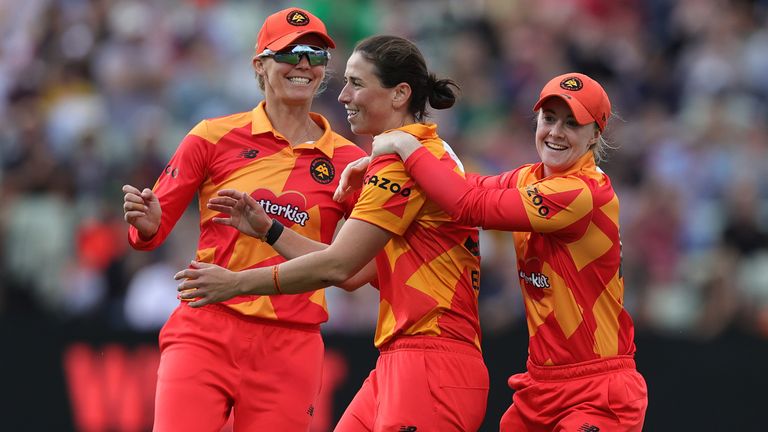 Georgia Elwiss of Birmingham Phoenix is mobbed by team mates after taking the wicket of Hollie Armitage during The Hundred clash with Birmingham Superchargers