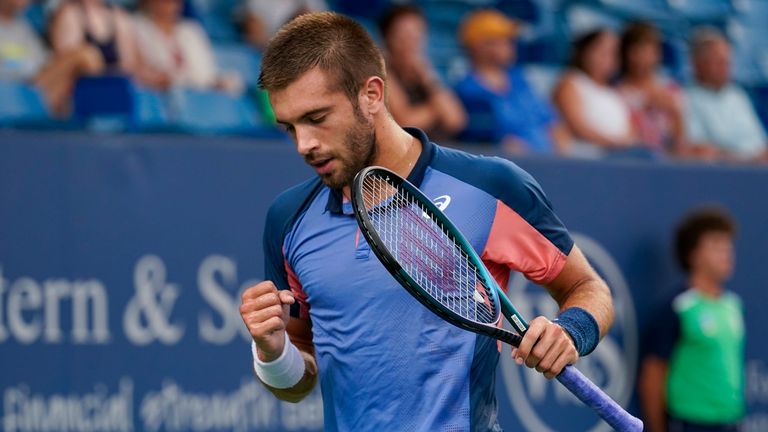 Borna Coric, of Croatia, reacts after scoring a point against Cameron Norrie, of Britain, during a semifinal match of the Western & Southern Open tennis tournament Saturday, Aug. 20, 2022, in Mason, Ohio. (AP Photo/Jeff Dean)