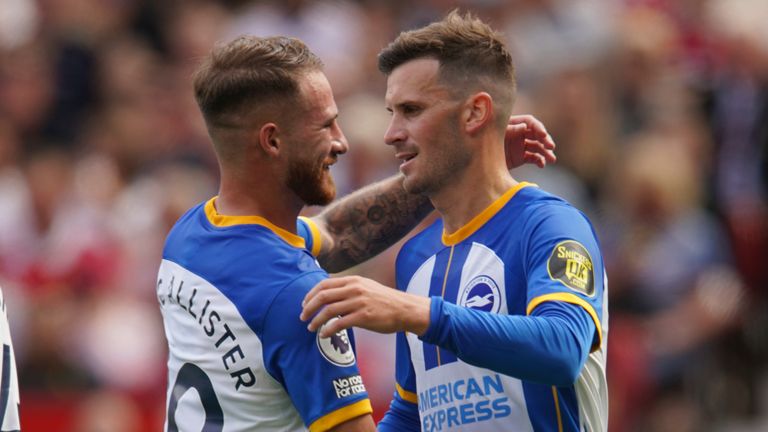 Brighton's Pascal Gross celebrates with his team-mate Alexis Mac Allister after scoring his opening goal against Manchester United