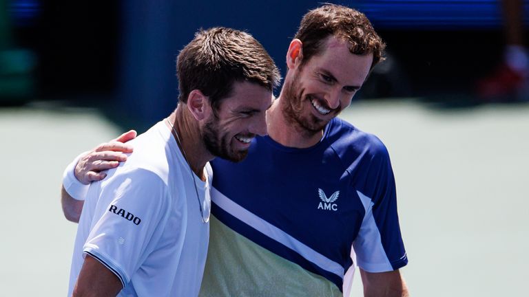 Cameron Norrie of Great Britain embraces Andy Murray of Great Britain after beating him in the second round of the men's singles at the Lindner Family Tennis Center on August 17, 2022 in Mason, Ohio. (Photo by Frey/TPN/Getty Images)