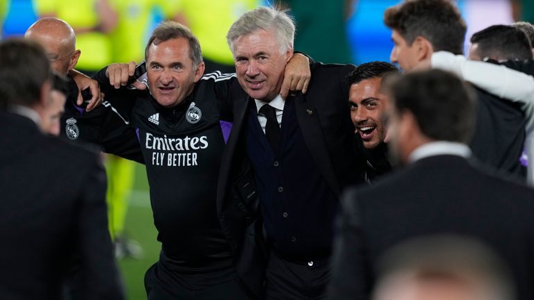 Real Madrid's head coach Carlo Ancelotti, centre, celebrates with his staff after winning the UEFA Super Cup final soccer match between Real Madrid and Eintracht Frankfurt at Helsinki's Olympic Stadium, Finland, Wednesday, Aug. 10, 2022. Real Madrid won 2-0. (AP Photo/Antonio Calanni)